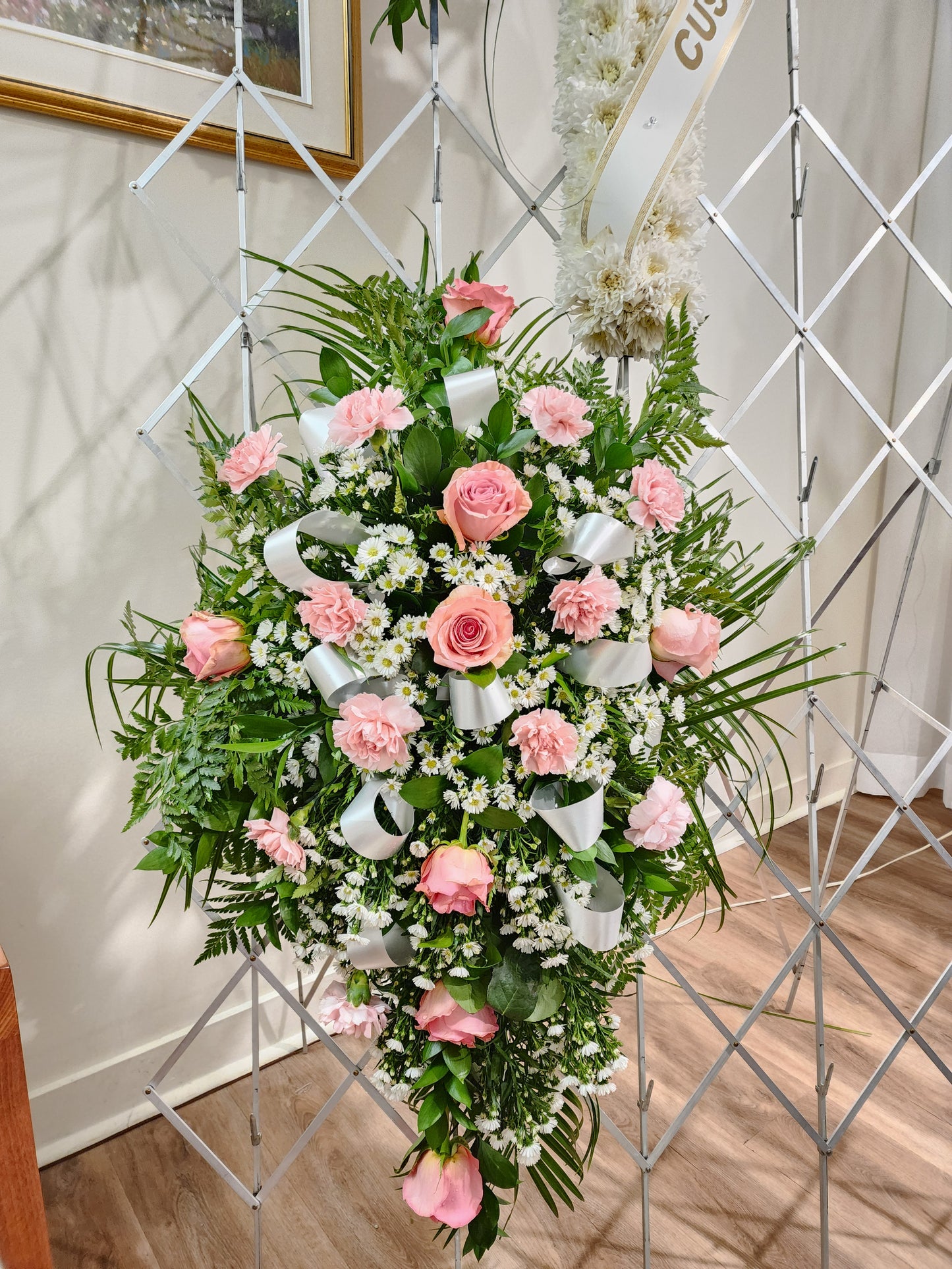Cascade style funeral flowers