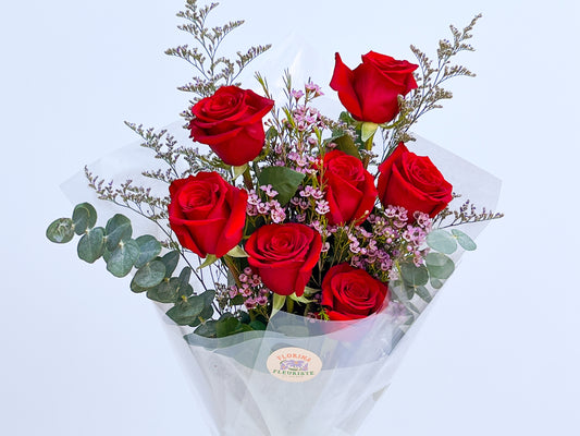 7 Roses and wax flowers